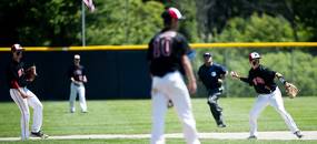 Milan junior Kyle Schrader throws to first for an out in the game against Richmond on Friday, June 14. Daniel Brenner I AnnArbor.com